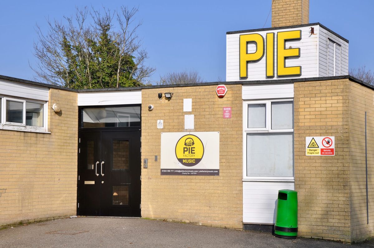 A one storey building bearing a sign reading 'PIE'