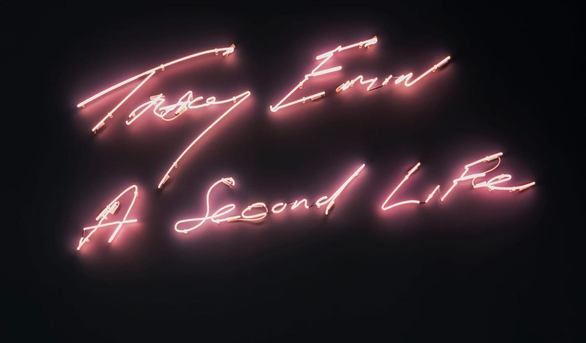 A pink neon sign reads Tracey Emin A Second Life