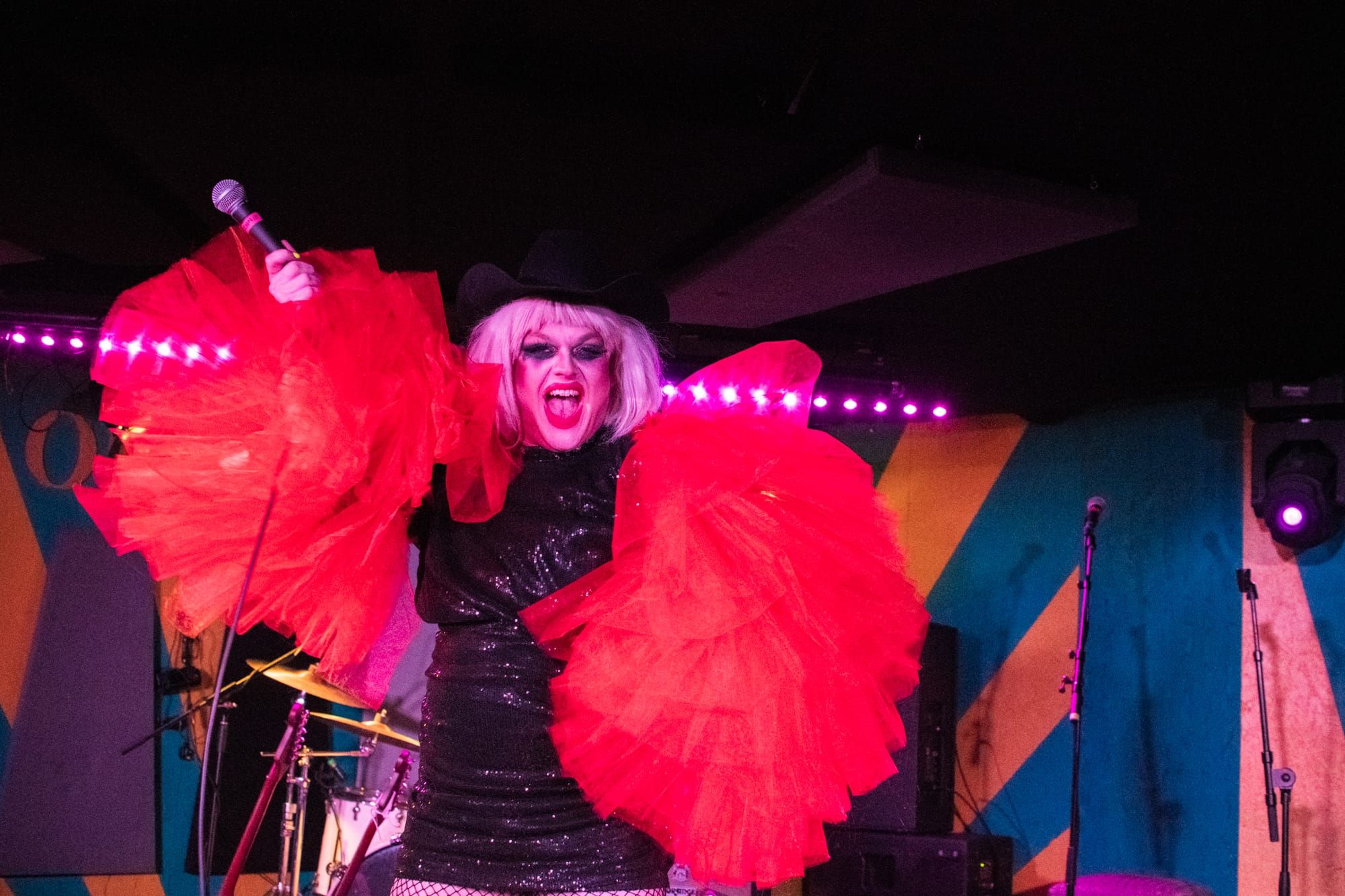 A drag queen performs on stage