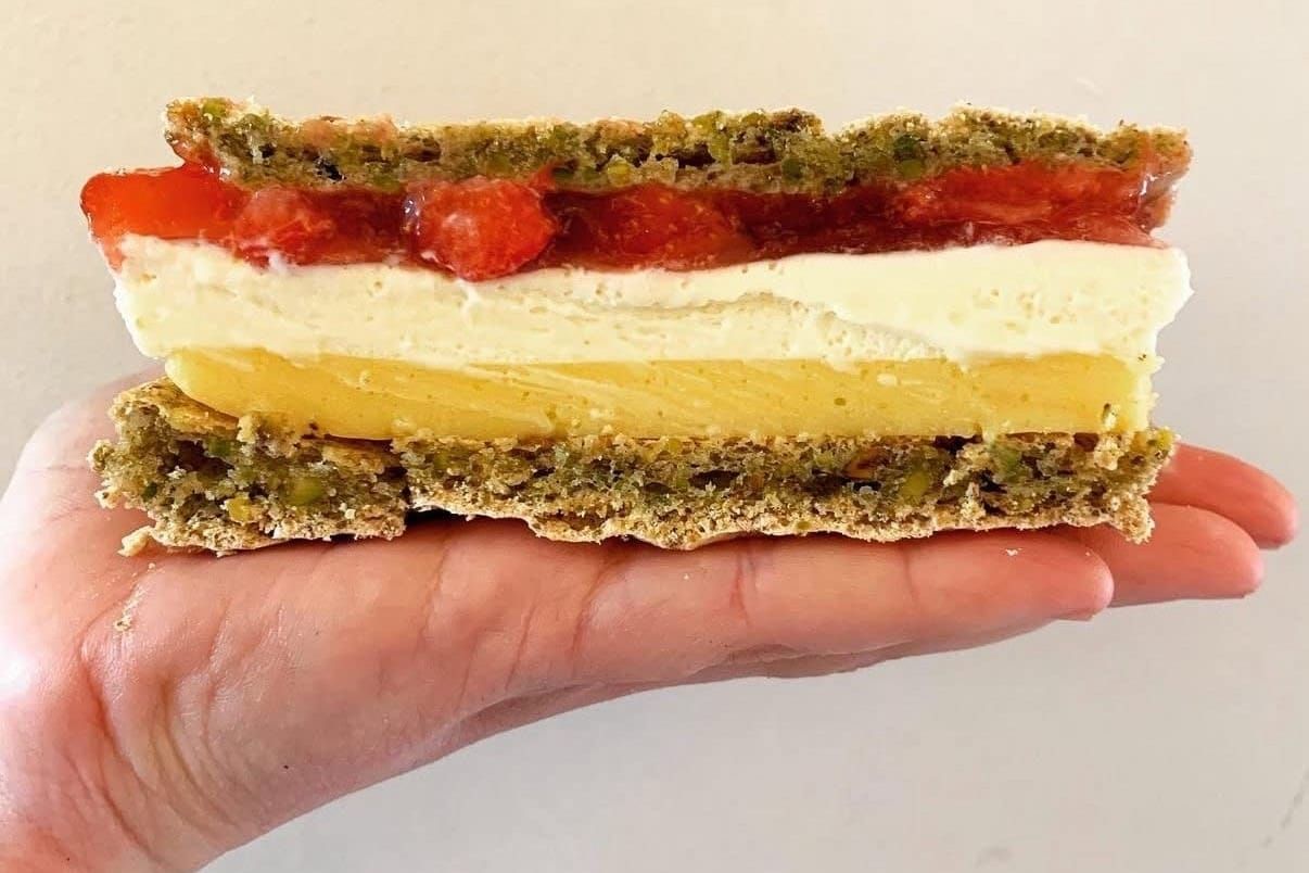 A strawberry, ice cream and custard sandwich