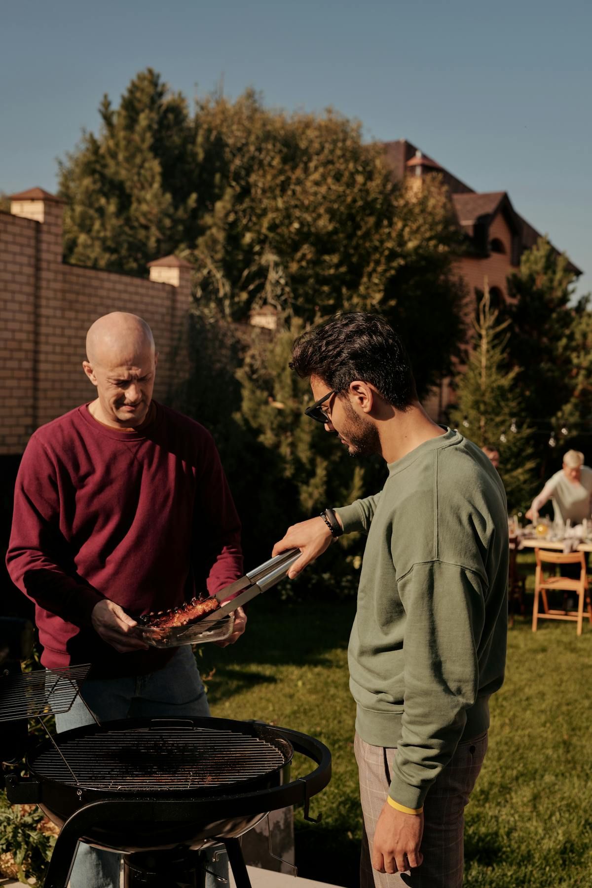 Person at an outdoor patriotic American-flag barbecue gathering