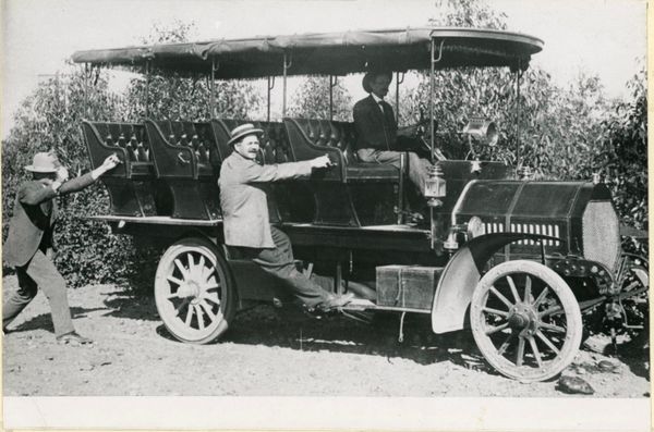 Vintage bus with three men