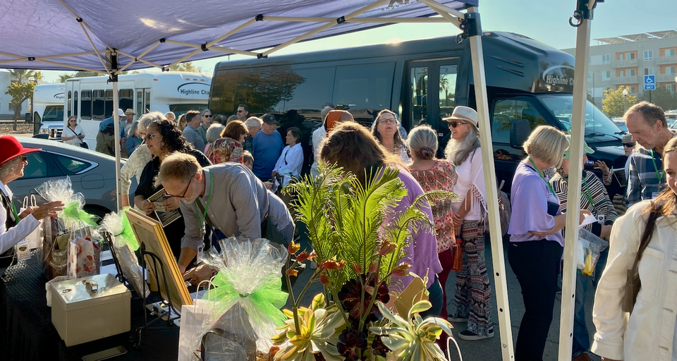 Home Tour guests waiting near the shuttle.