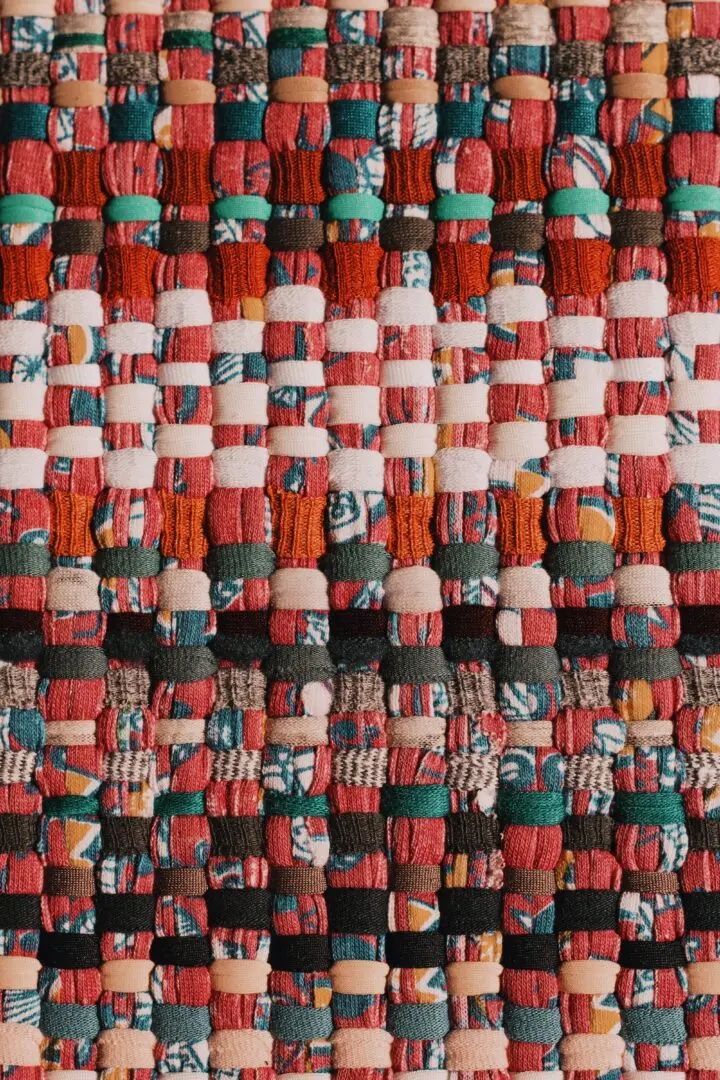 Close up of colourful woven tapestry