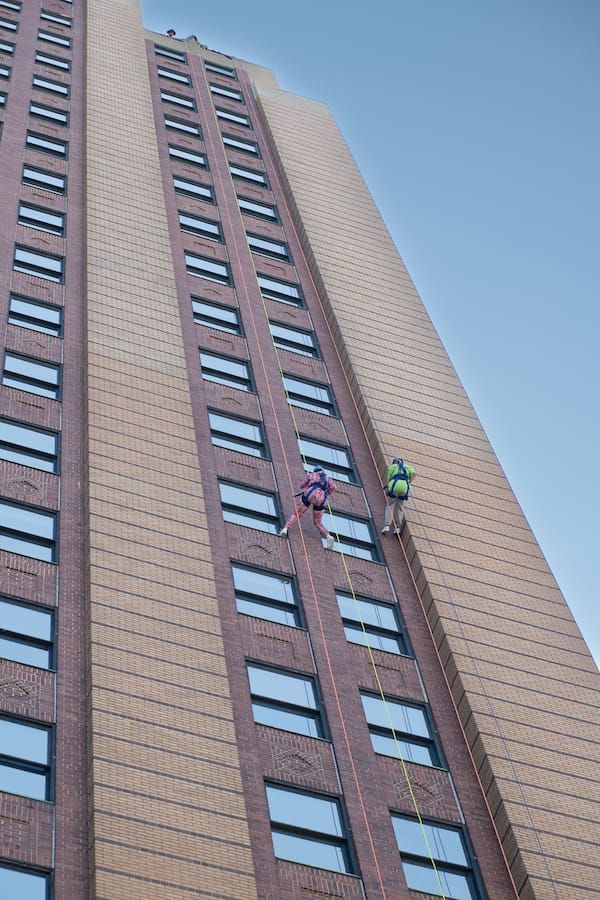 Women's Center Fundraiser sees Participants Rappel Down Boji Tower