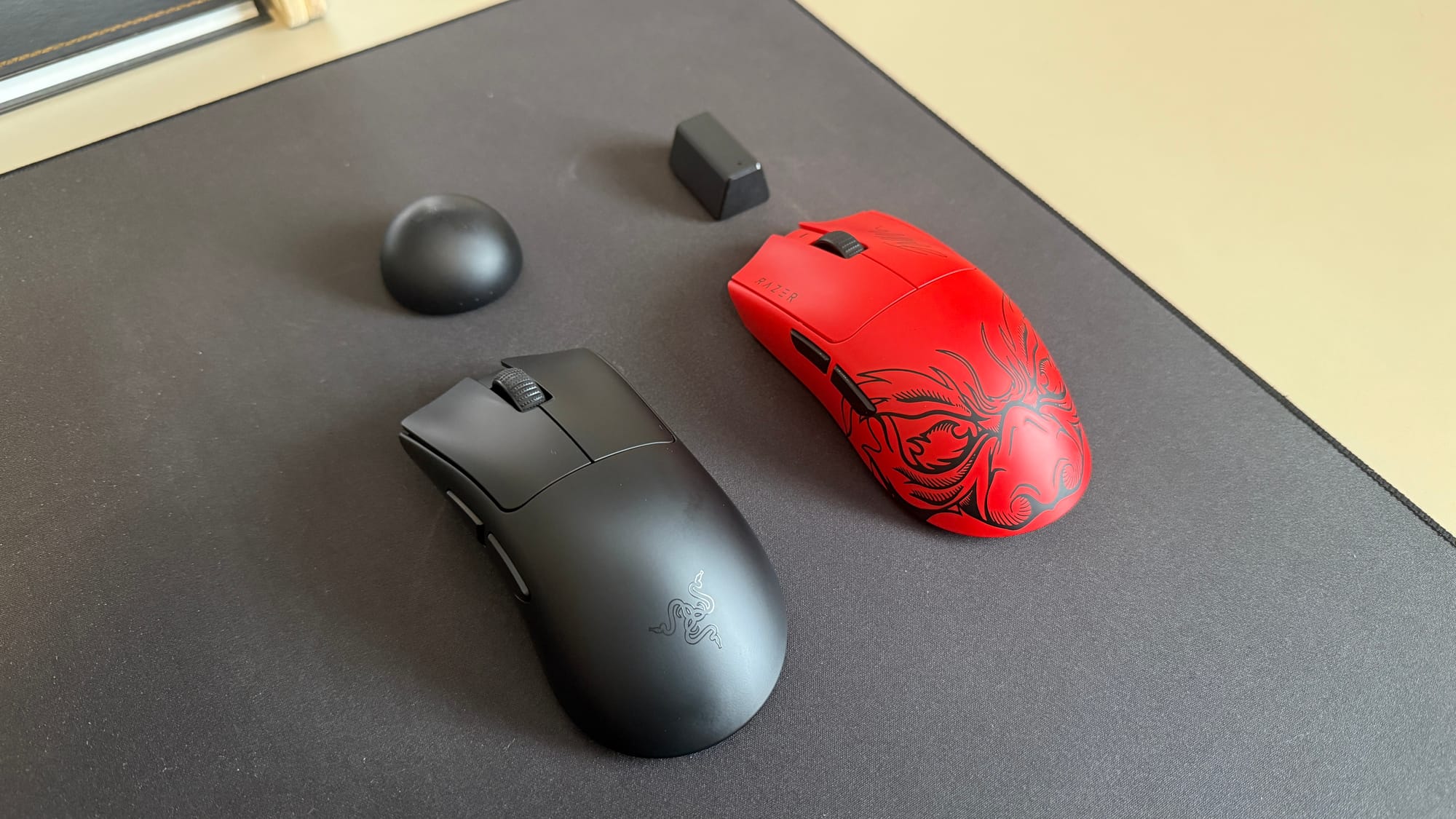 Deathadder V4 Pro beside Viper V3 Pro with each dongle in front of them