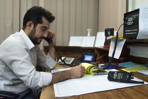 receptionist answering phone at front desk
