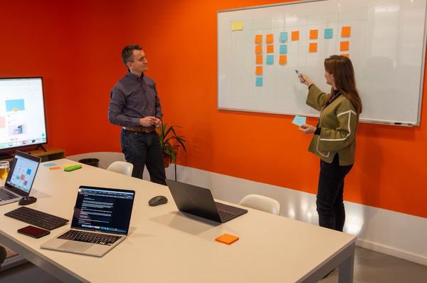 team meeting reviewing data and charts