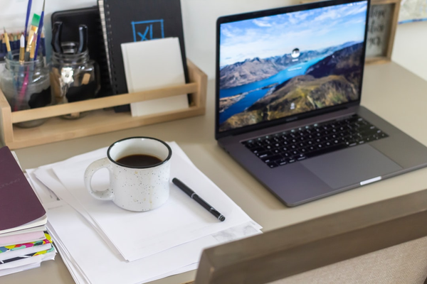 business workspace laptop phone paperwork
