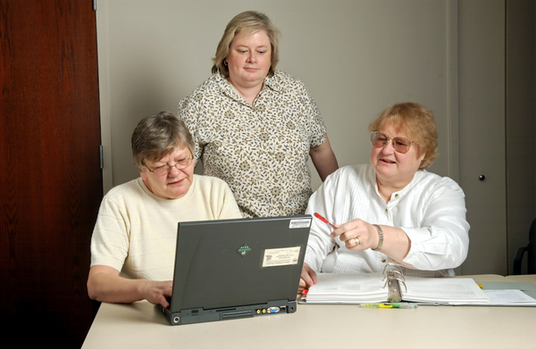 team working on laptop dashboard