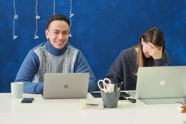 team collaboration around laptop