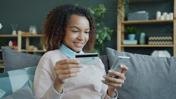 person using smartphone shopping online