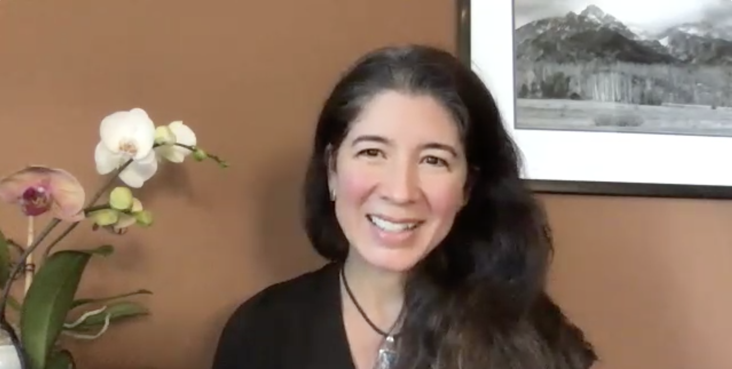 Screenshot of a smiling affective scientist