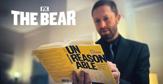 Screenshot from TV show The Bear, character of Richie is reading Unreasonable Hospitality