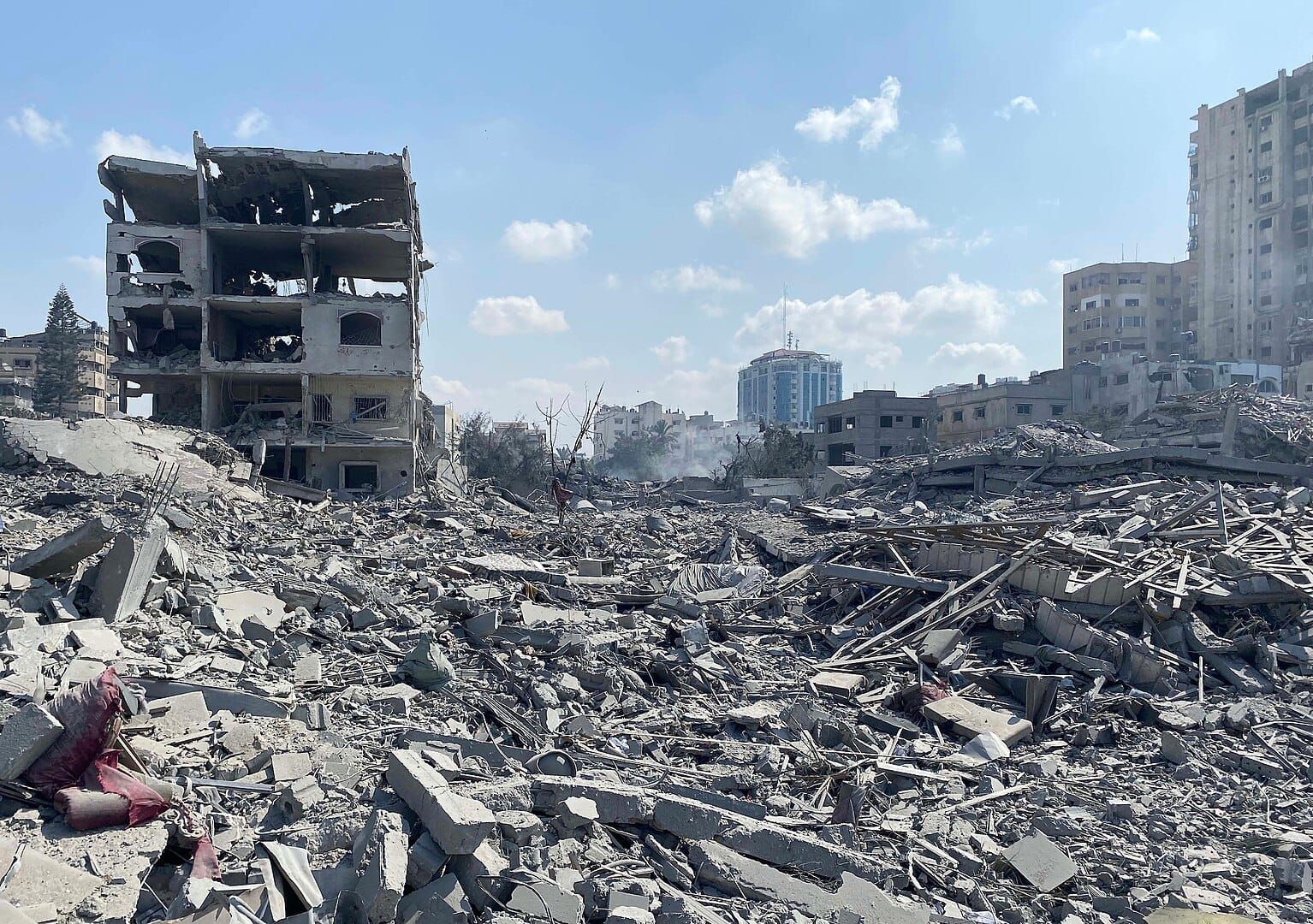 Image of rubble and bombed buildings following an air strike in Gaza City.
