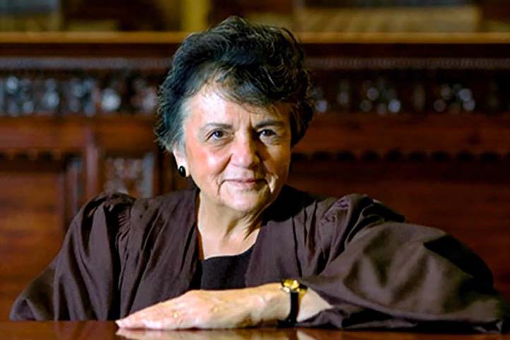 Shirley Abrahamson, wearing her judicial robes, with a slight smile on her face.