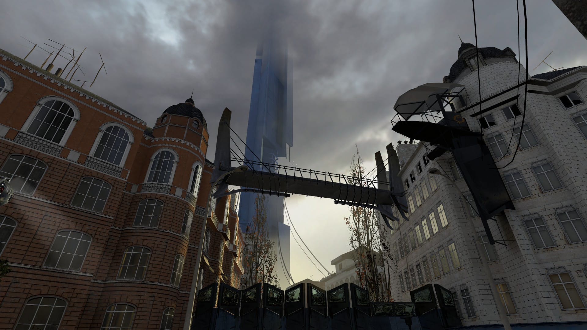 The Citadel tower viewed from below, through an alley in the city. There's a hazy light in the sky.
