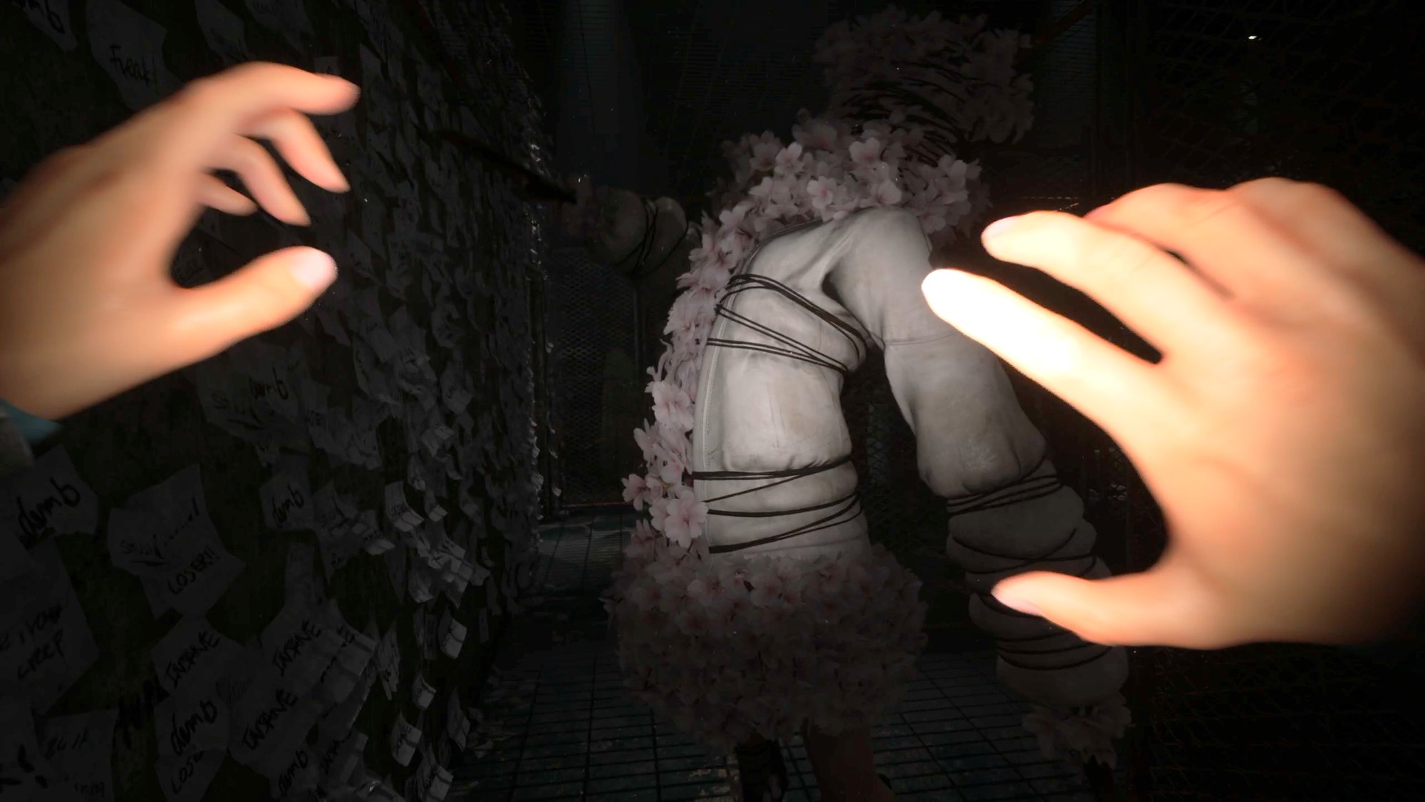 Sakura Head, a monster made of blossom and rope, lifts an arm to strike the player.