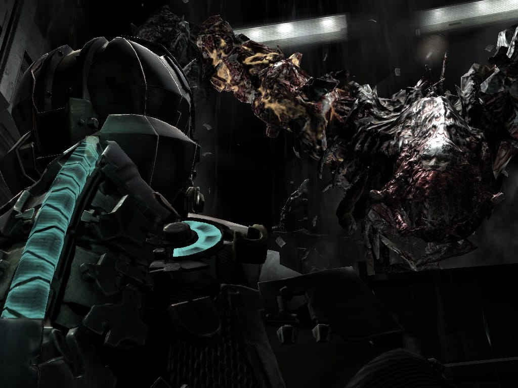 A grotesque monster with insectoid legs and a human face towers over the player.