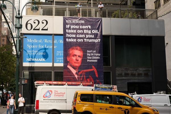 Over 40 groups call out Newsom for backsliding on climate promises, banner dropped in New York City