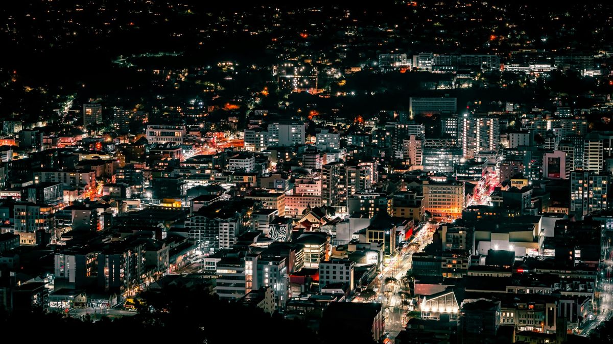 Picture of Wellington city at night facing west, with Courtney Place in the bottom left-ish half of the picture. 