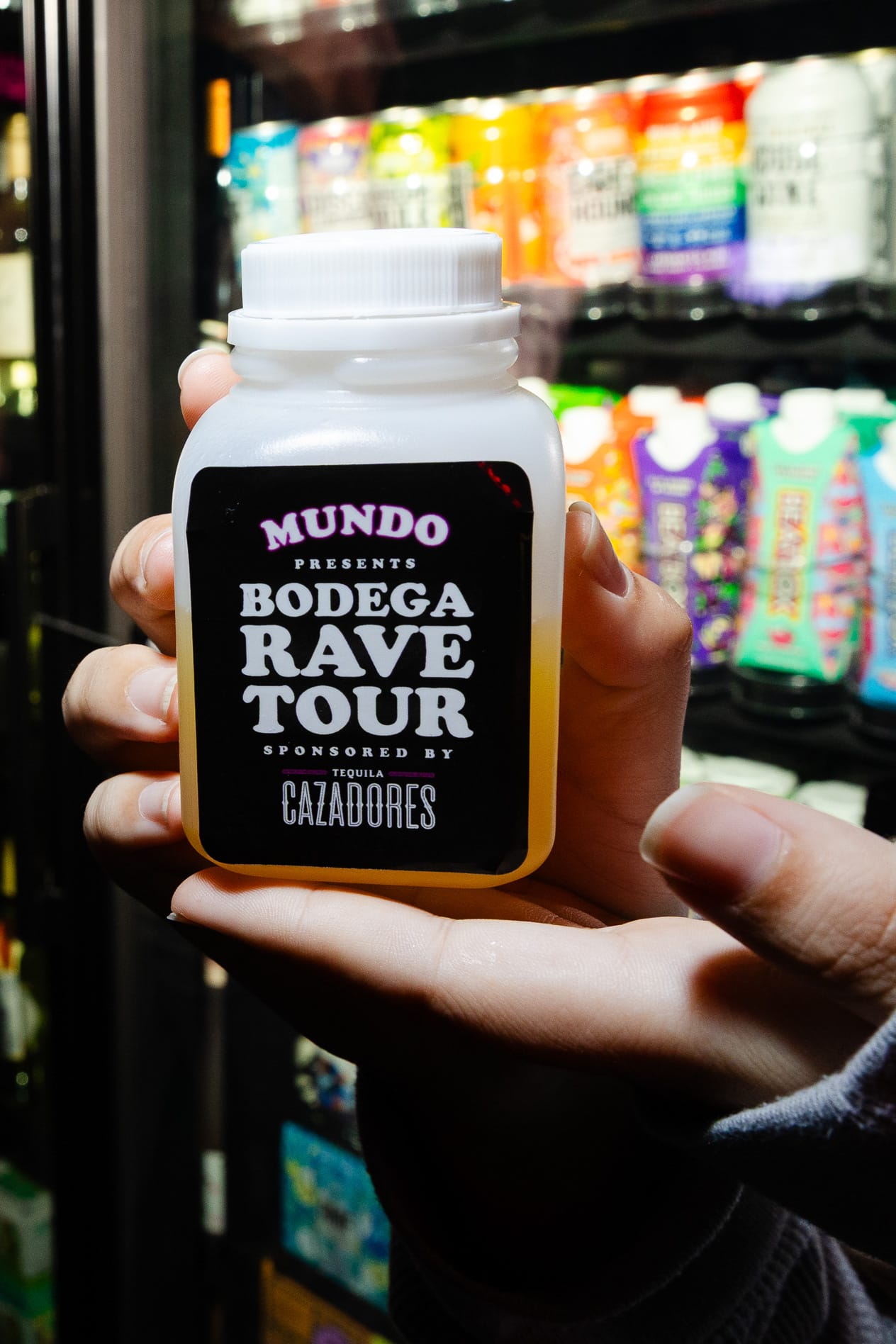 A pair of ands hold a custom cocktail. 