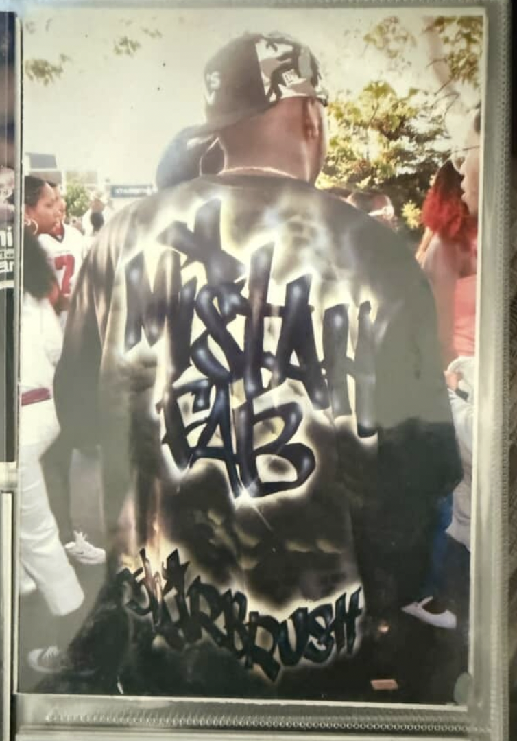 Framed photo of a man wearing a Mistah F.A.B. jacket.