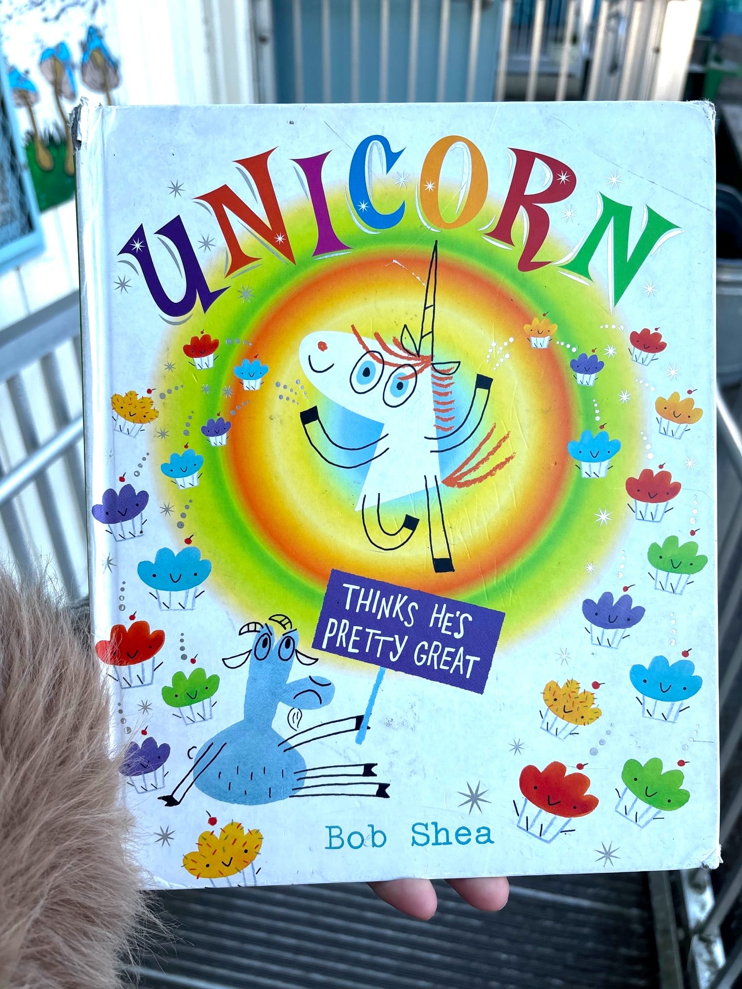a cover of a children's book called 'Unicorn Thinks He's Pretty Great' by Bob Shea, with a colorful drawing of a unicorn
