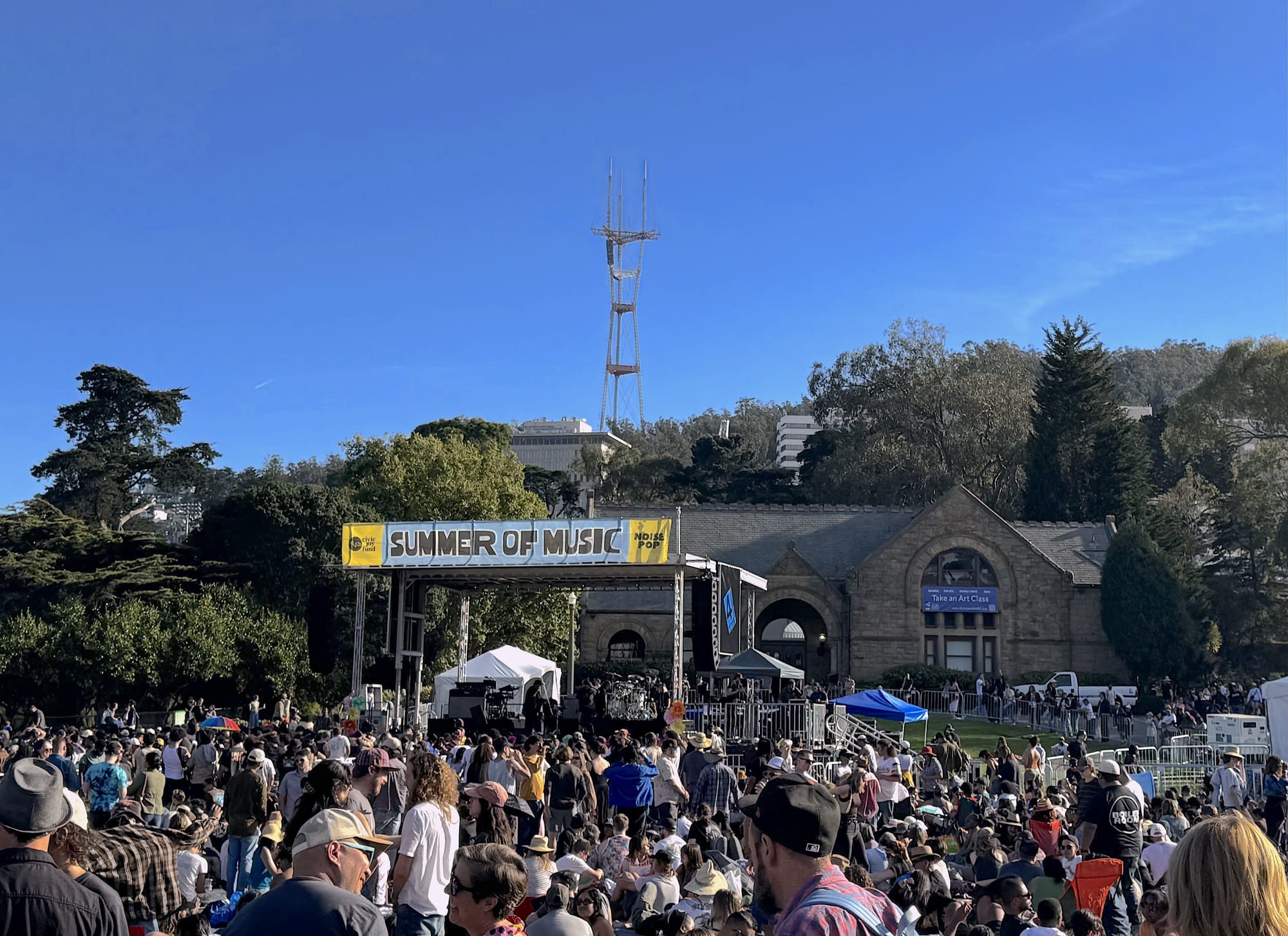 a music festival with the words 'summer of love' visible