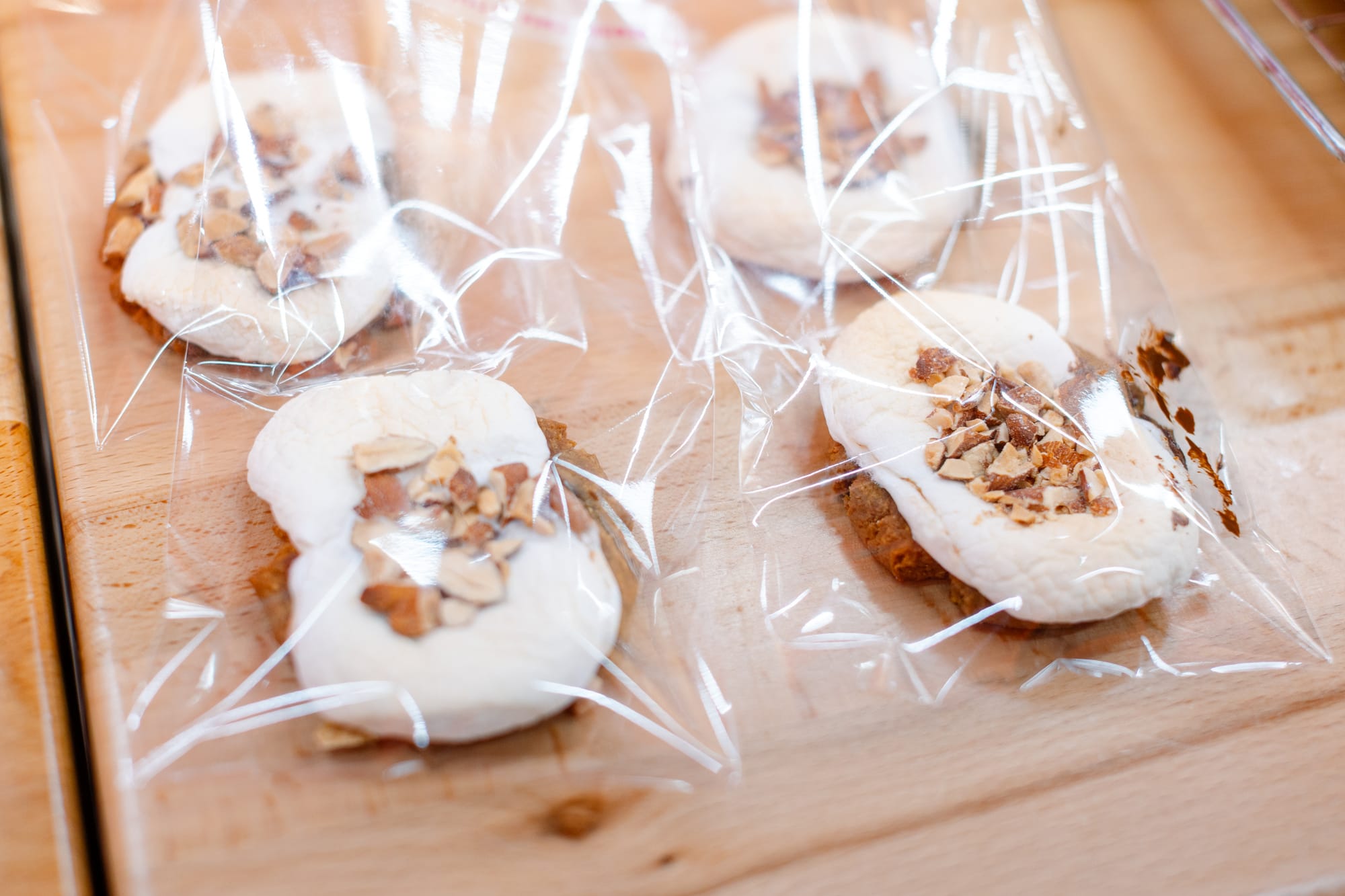Cookies with frosting wrapped in cellphone.