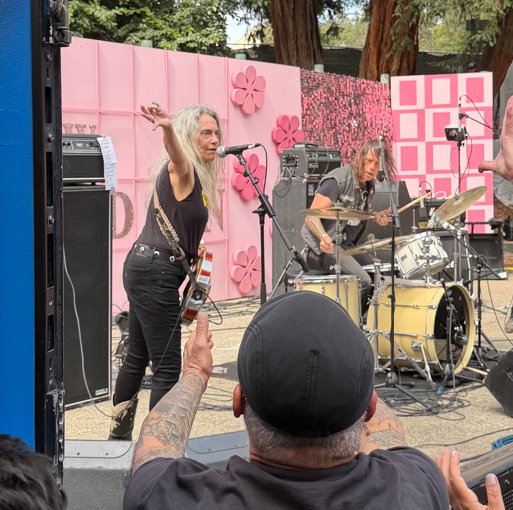 an older woman on stage at a punk festival