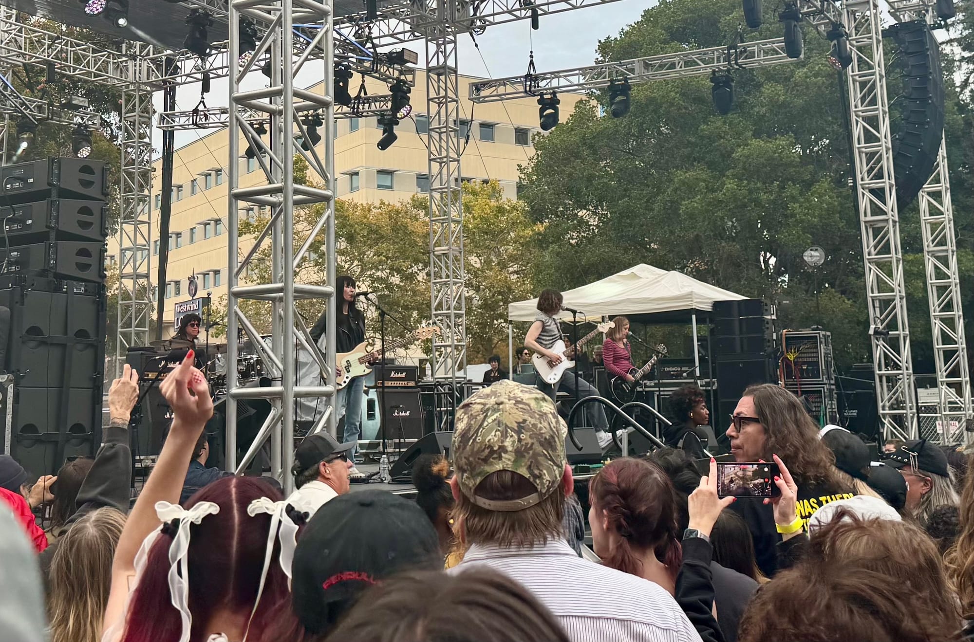 a ramones cover band plays at a crowded music festival