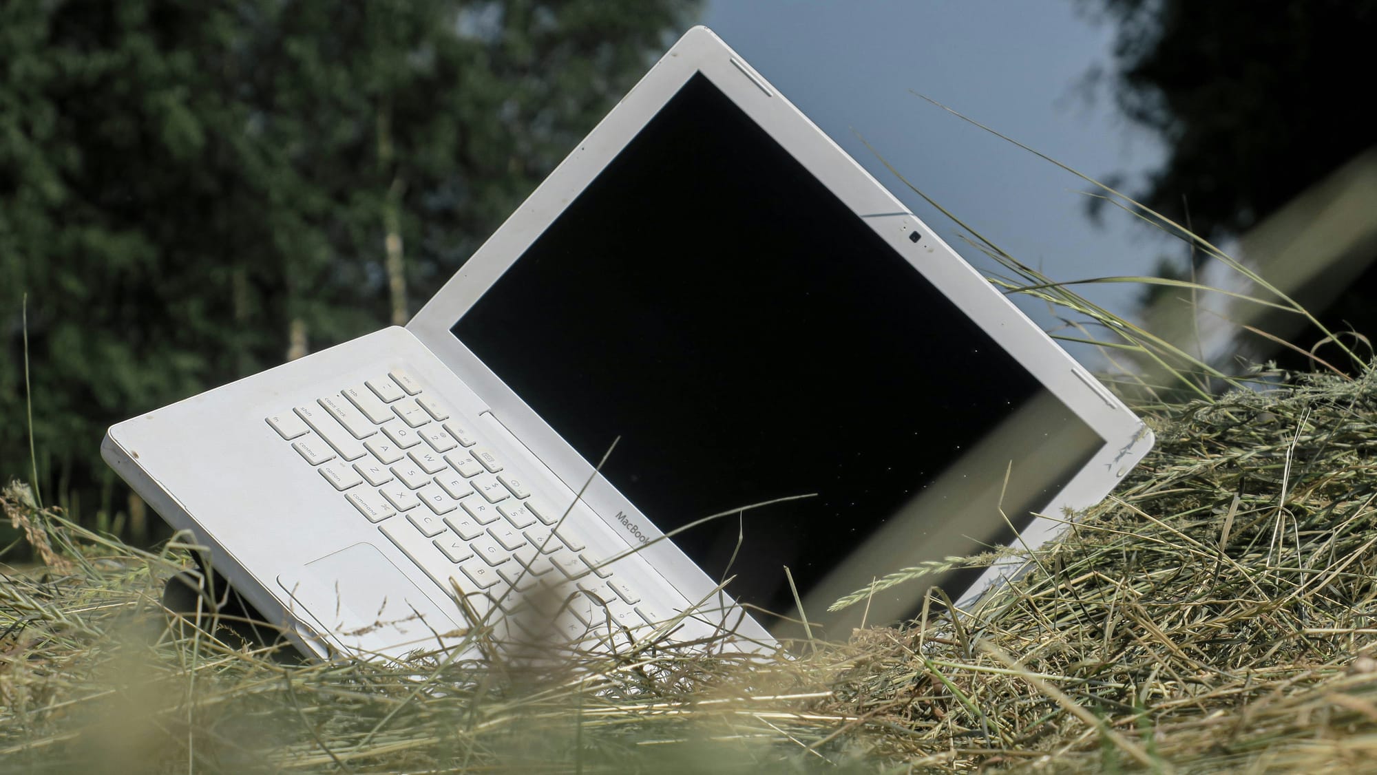 a laptop sideways in the grass