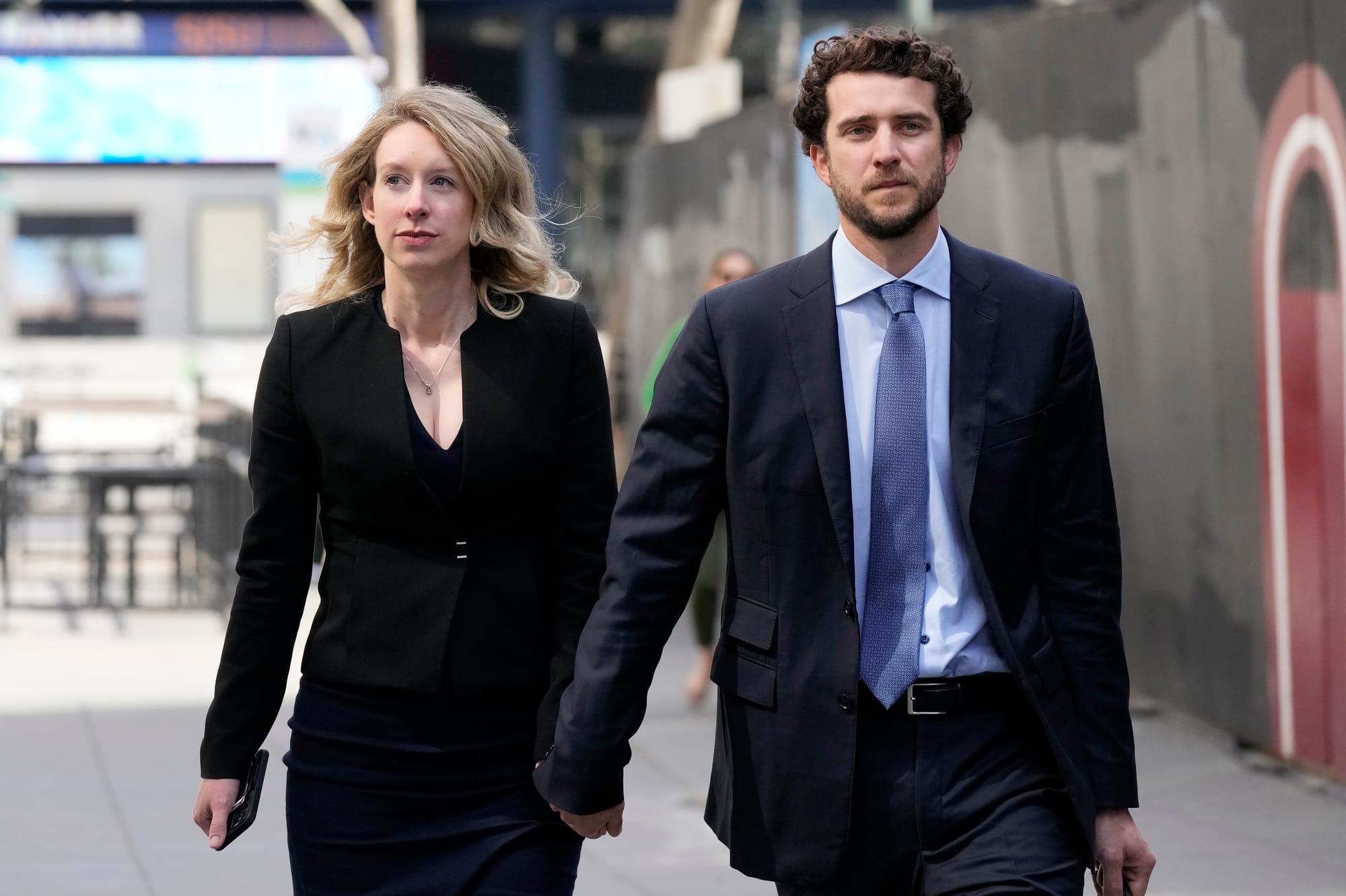 A woman and a man in business wear