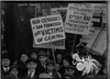 A photo from the Sympathy Labor Parade in 1916 . Photograph shows a crowd with a sign reading "Our comrades in San Francisco are victims of apital." 