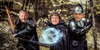 Badly photoshopped image of Chad Bianco, Katie Porter, and Xavier Becerra as fantasy warriors in a forest.