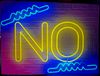 A colorful neon sign on a brick wall spells out "NO"