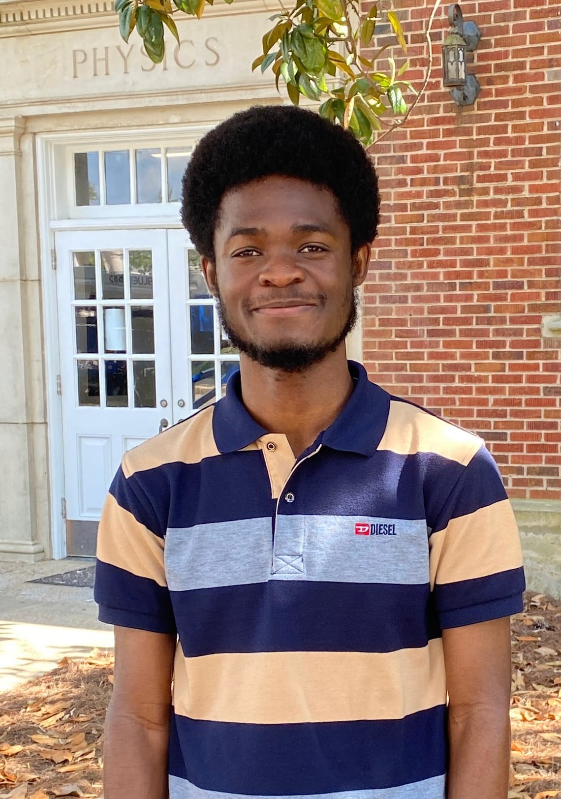 Headshot of Samuel Junior Osei-Nketiah in front of the Physics building