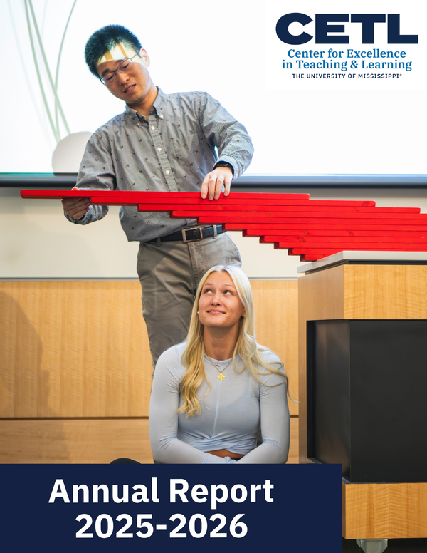 Instructional Associate Professor of Physics and Astronomy Bin Xiao is shown demonstrating a concept from physics in his classroom by stacking red boards above a student sitting below.