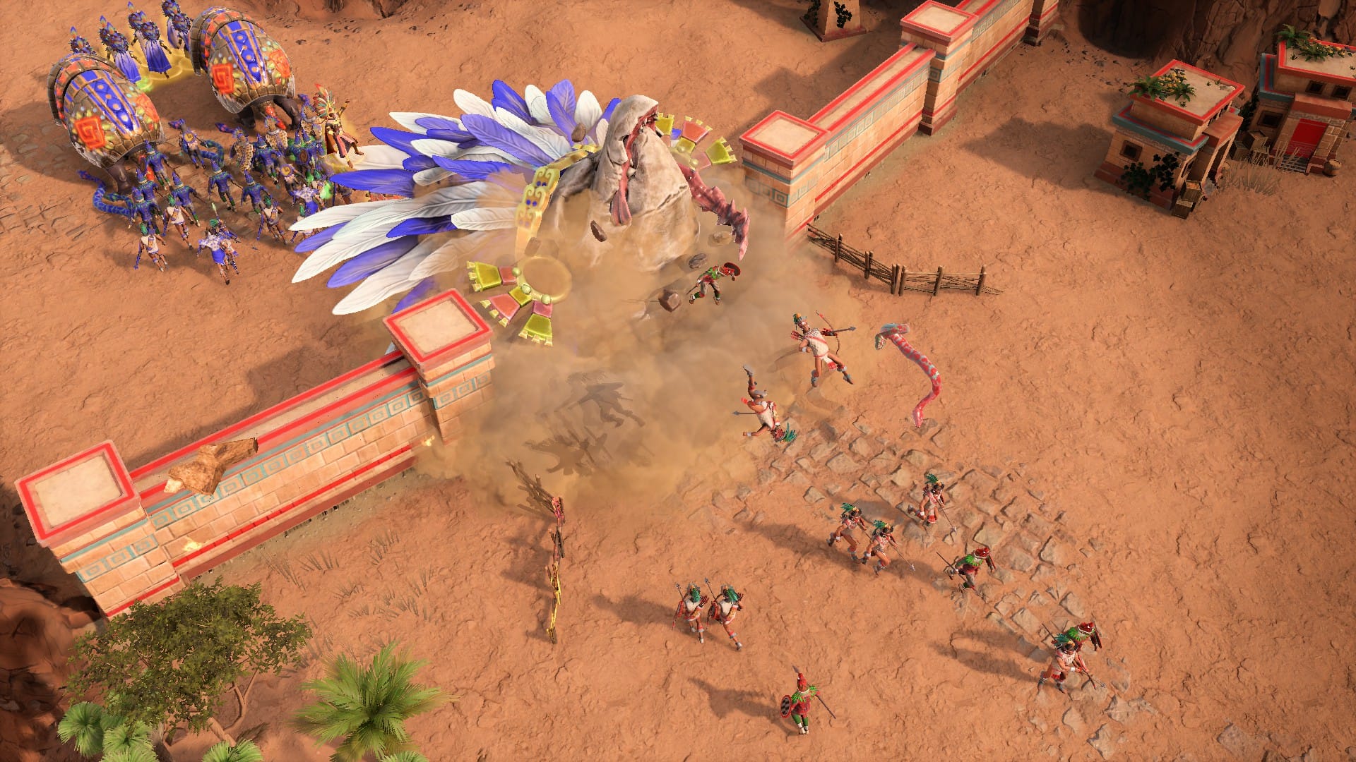 A giant monster with a feathered headdress erupting from underneath an army, scattering people everywhere.