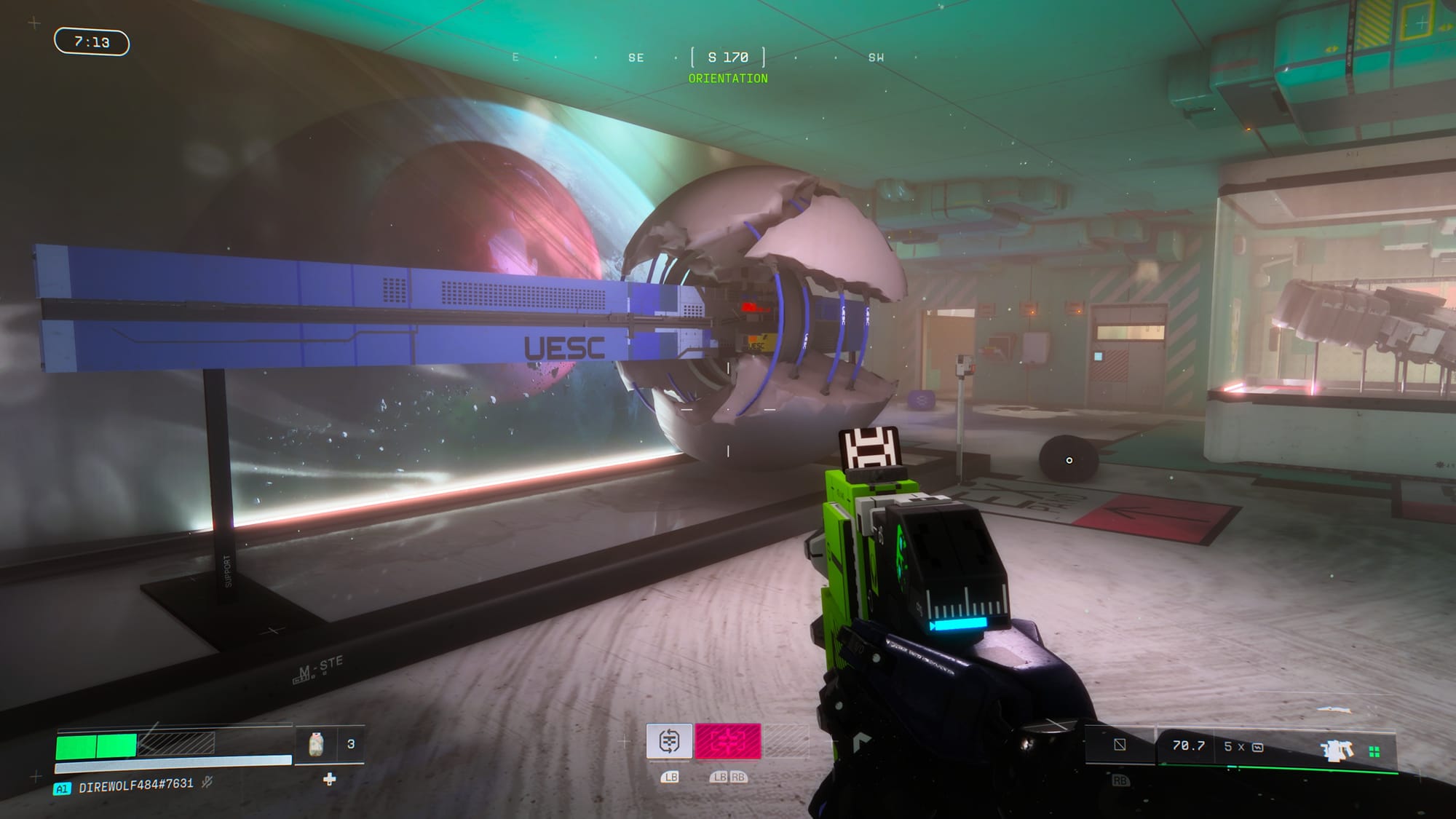 A first-person view of a model ship with the letters UESC painted on its side.