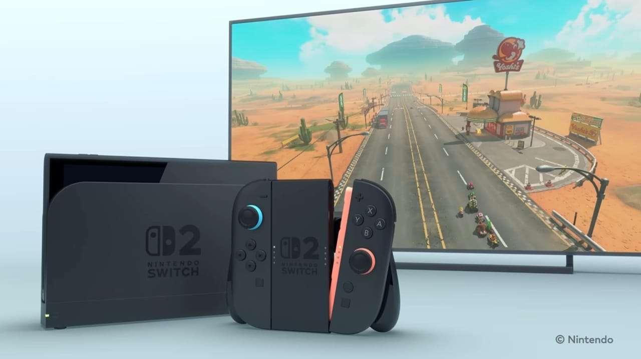 A Nintendo Switch 2 console, dock, Joy-Con controllers, and a TV screen showing Mario Kart.