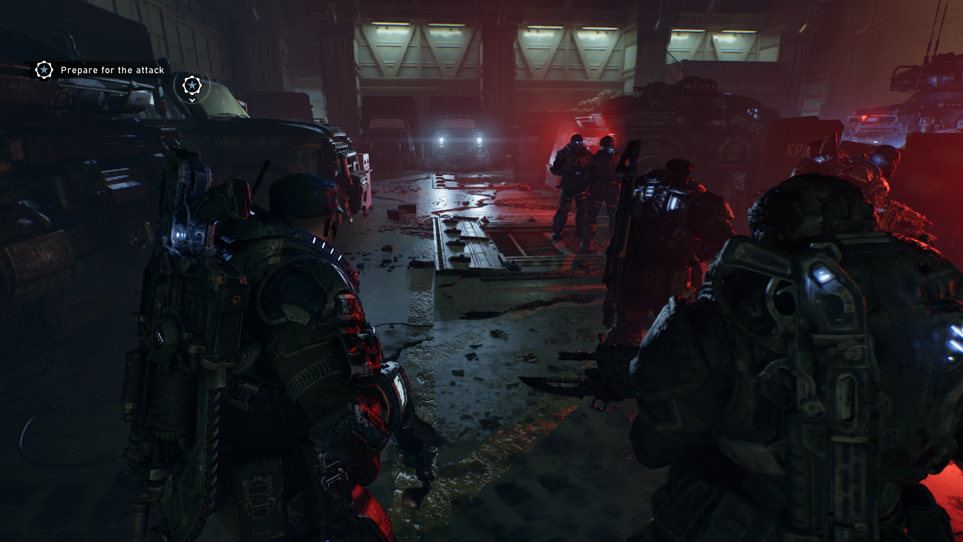 A few soldiers in dim red lighting in Gears of War: E-Day