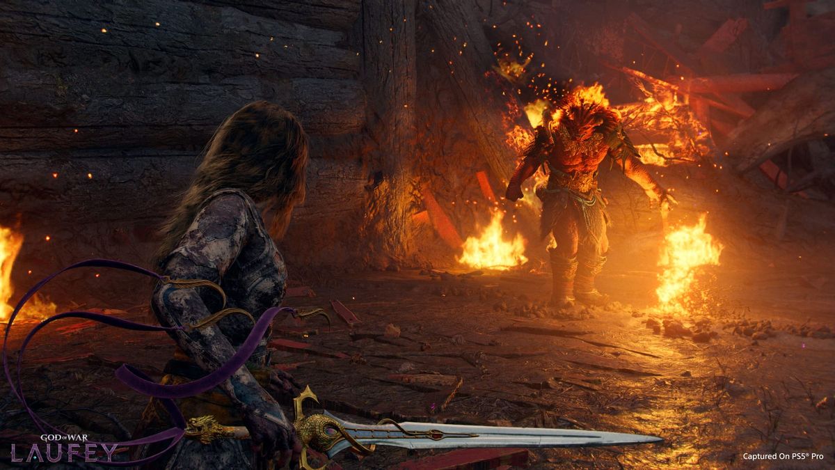 Faye in God of War Laufey facing off against a flaming monster