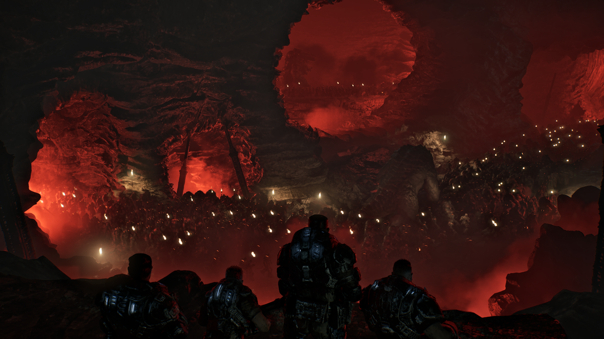 Four humans overlooking a ridge with hundreds of Locust below in Gears of War: E-Day