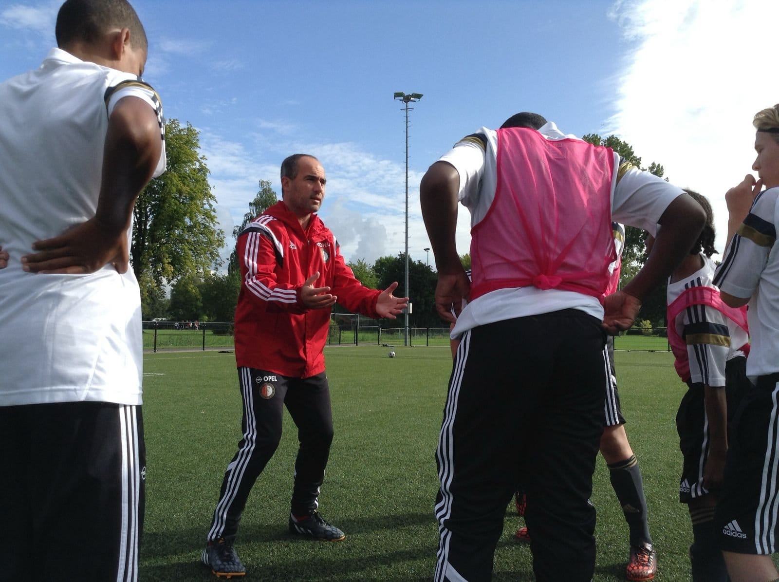 Damien Hertog coaching young players during a Feyenoord academy training session