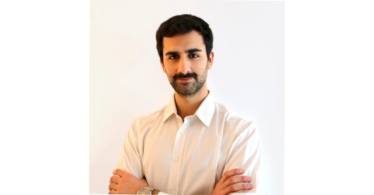 Miguel Gouveia, business developer at ScoutDecision, in a white shirt with arms folded, in a head-and-shoulders portrait against a plain white background.
