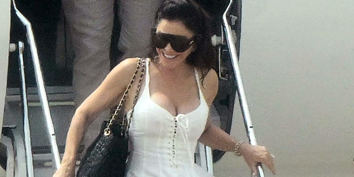 Lauren Sánchez Bezos Emerges From Her Private Jet in a Fitted, Lace-Up Sundress