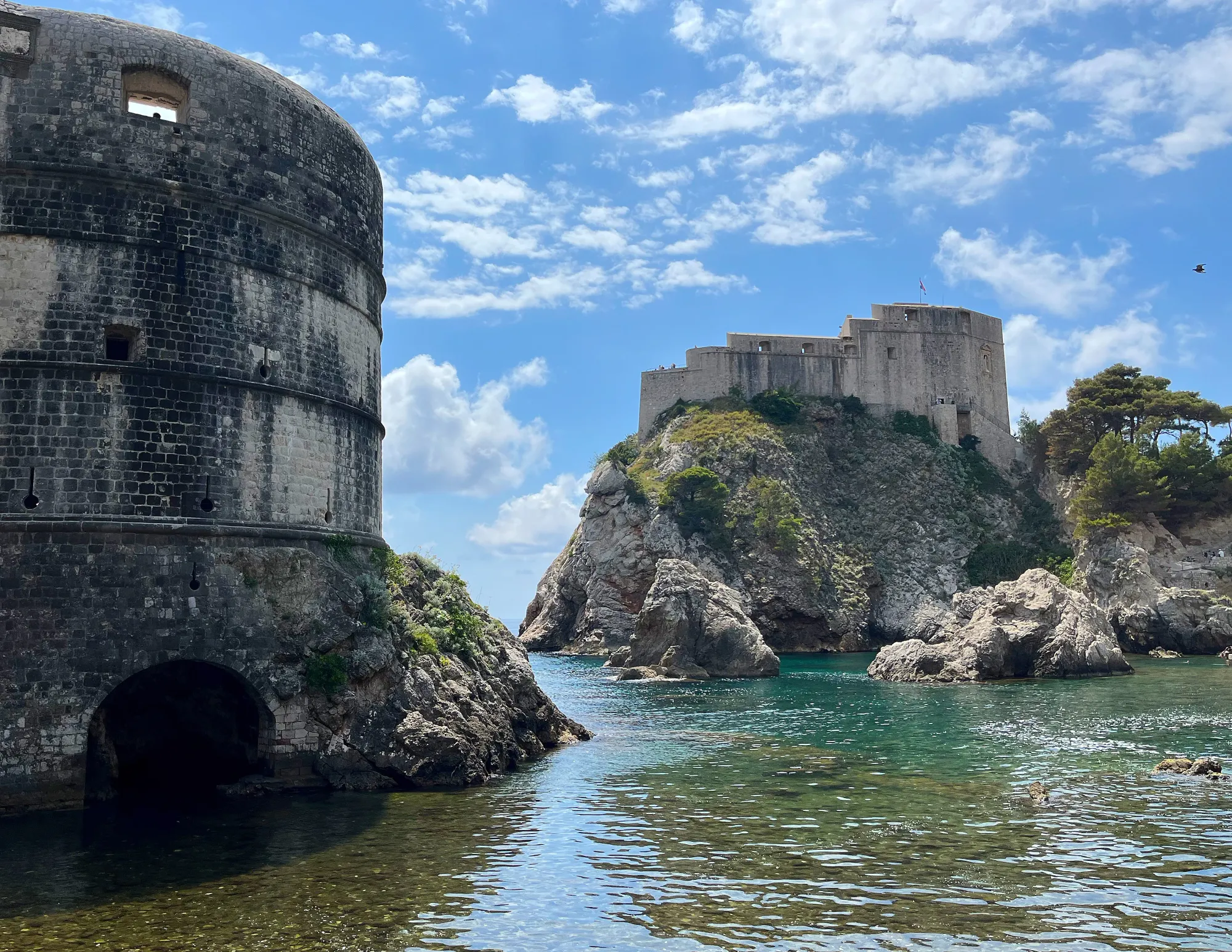 Stone walls and a fortress surrounding a sea bay