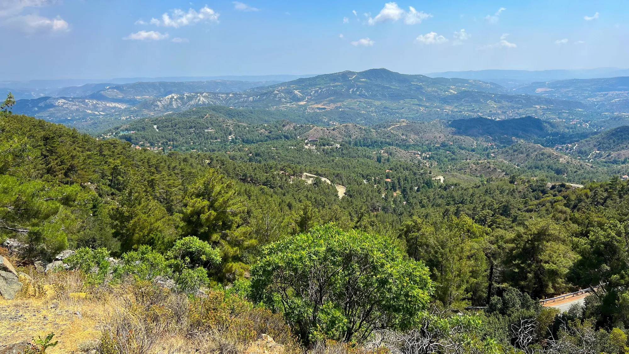 Rolling green hills on a lightly cloudy day